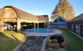 The Log Cabin Apartments Hotel
